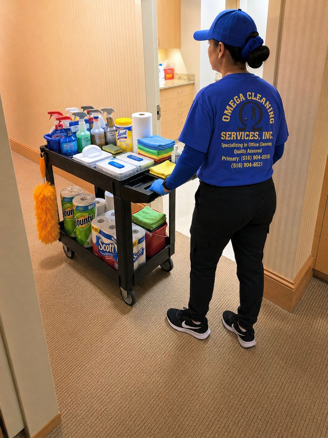 Staff pushing cleaning cart